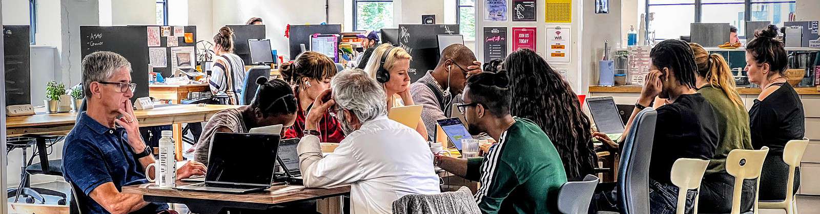 Group of writers around a table at a coworking space